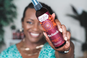 Uncle Funky's Daughter bottle in hand for scale showing convenient 8 oz travel-friendly size