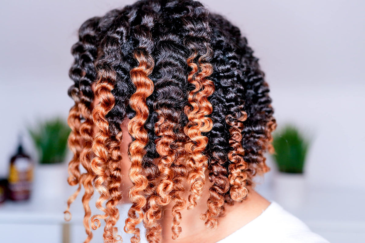 Uncle Funky's Daughter being applied to curly hair for easier styling