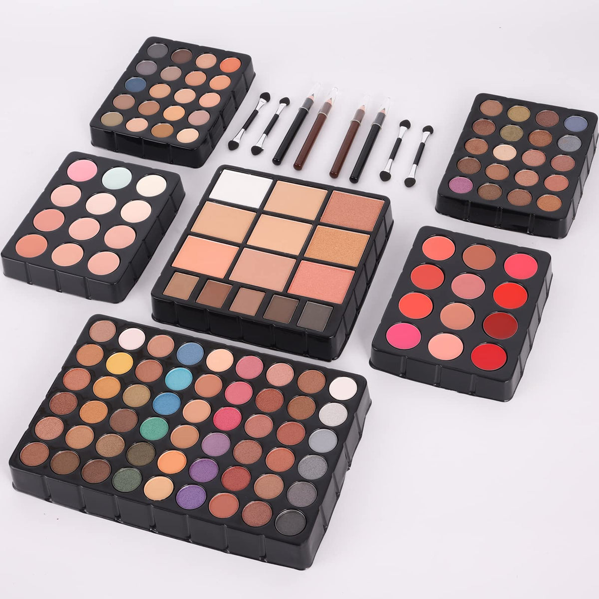 UNIFULL brushes and tools laid out to demonstrate included applicators for complete routines