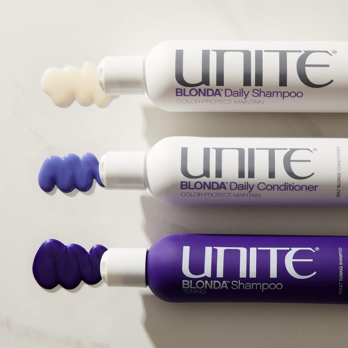 UNITE Hair BLONDA held in hand for scale showing compact 8 fl oz size benefit