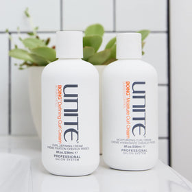 UNITE BOING held in hand to show 8 fl oz size and portability