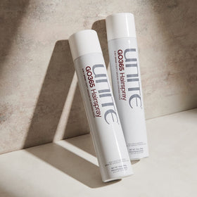 UNITE GO365 can beside a hand to show 10 oz size for travel and salon use