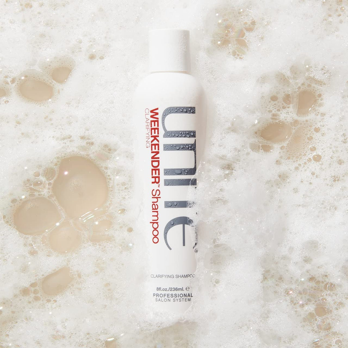 UNITE Hair WEEKENDER texture close-up on palm showing creamy lather and gentle cleansing