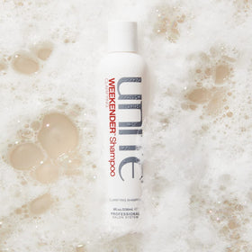 UNITE Hair WEEKENDER texture close-up on palm showing creamy lather and gentle cleansing