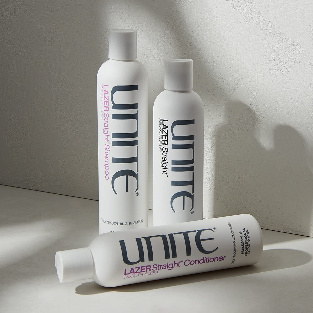 UNITE LAZER used in salon-style blowout showcasing smooth, shiny hair and humidity resistance