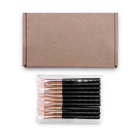 UorPoto brushes beside a coin showing compact size and travel-friendly scale