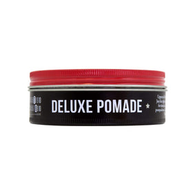 UPPERCUT DELUXE pomade on hand illustrating easy warm-and-apply benefit