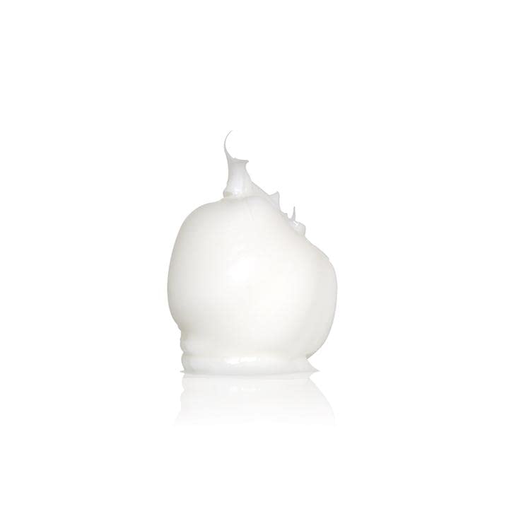 Uppercut Deluxe tub in hand to show 2.5oz scale and travel-friendly size benefit