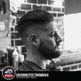 UPPERCUT DELUXE label close-up highlighting barber-crafted quality and ingredients