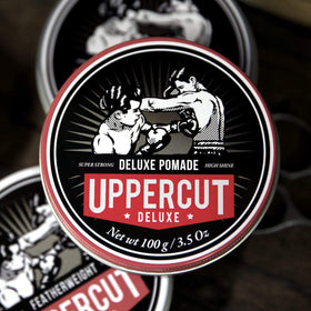 UPPERCUT DELUXE label closeup showing ingredients and barber-grade claim