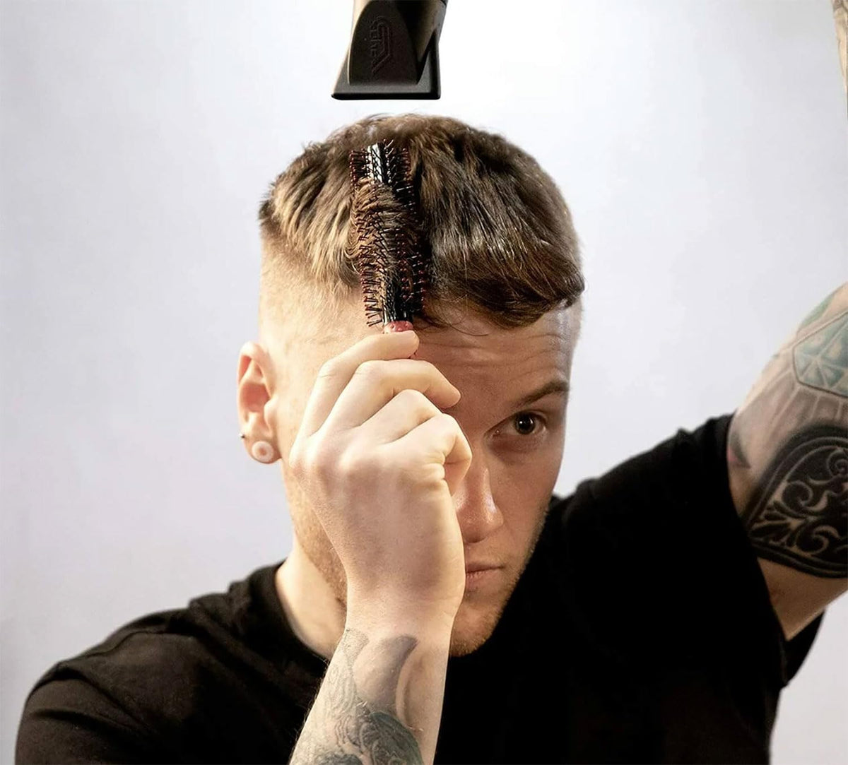 UPPERCUT DELUXE brush on counter beside pomade for pre-styling routine