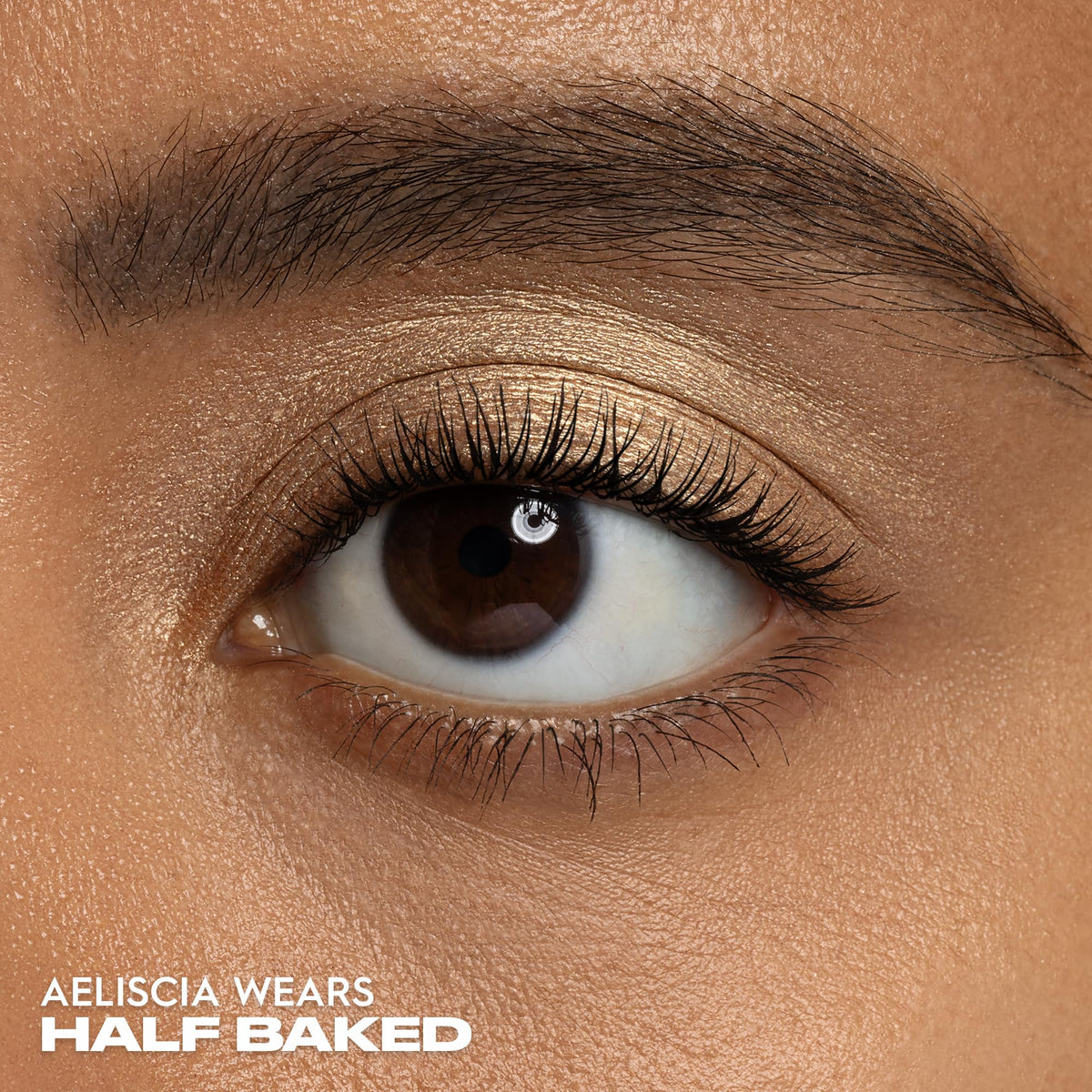 Urban Decay Half Baked held in hand to show compact size and travel-friendly benefit