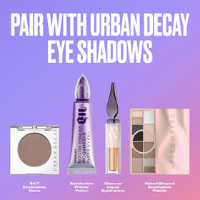 Urban Decay primer in a makeup bag lifestyle scene showing everyday use and portability