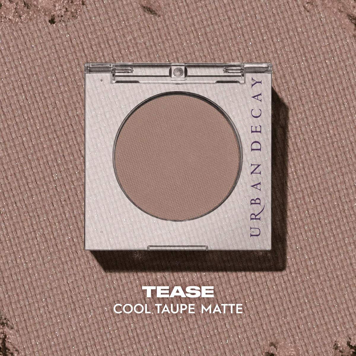 URBAN DECAY compact next to fingertip showing true size and travel-friendly benefit