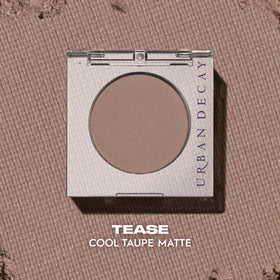 URBAN DECAY compact next to fingertip showing true size and travel-friendly benefit