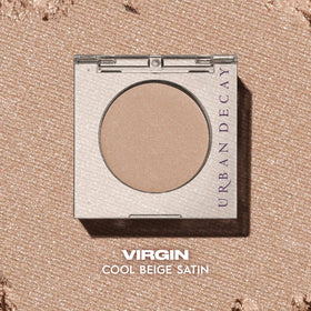 Urban Decay Virgin swatch on arm showing true satin beige payoff and buildable coverage