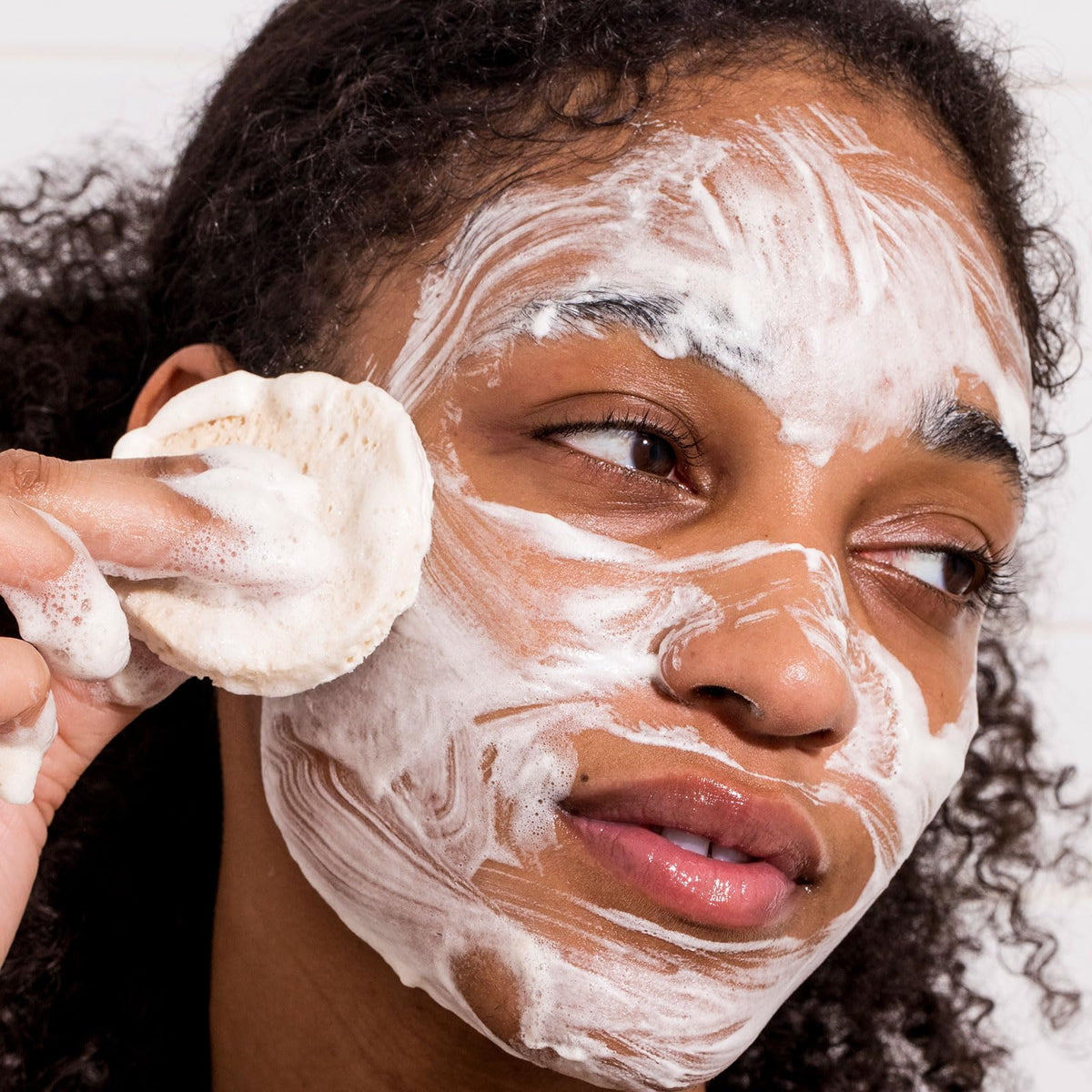 Urban Skin Rx bar in hand demonstrating size and travel-friendly convenience