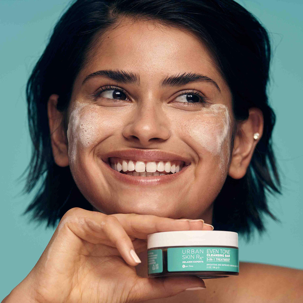 Urban Skin Rx sponge applying lather to face for even coverage