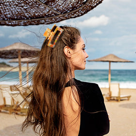 urrykid clips styled on a model at the beach, bright summer accessory