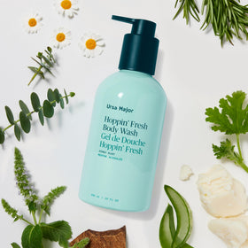 Ursa Major bottle on shower shelf in lifestyle scene for refreshing routine