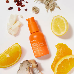 Ursa Major applying serum to cheek showing lightweight absorption and smoothing benefit