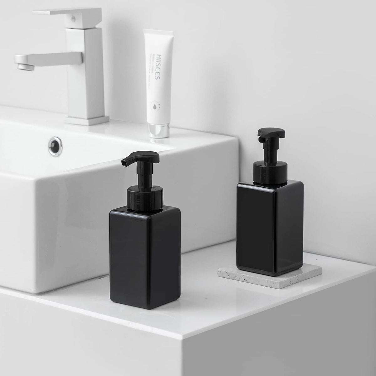 UUJOLY foam dispensed into hand demonstrating rich lather and reduced soap use