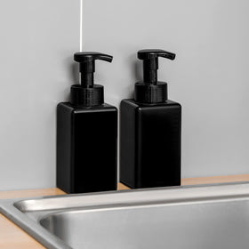 UUJOLY bottle beside bathroom sink showing scale and practical countertop placement