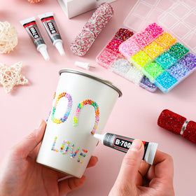 UWETIME layout of B7000 glue, tweezers and dotting pen for precise gem application