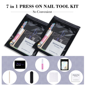 Uyolaxed contents laid out displaying files, glue, tabs, sticks, pads, bags for quick prep