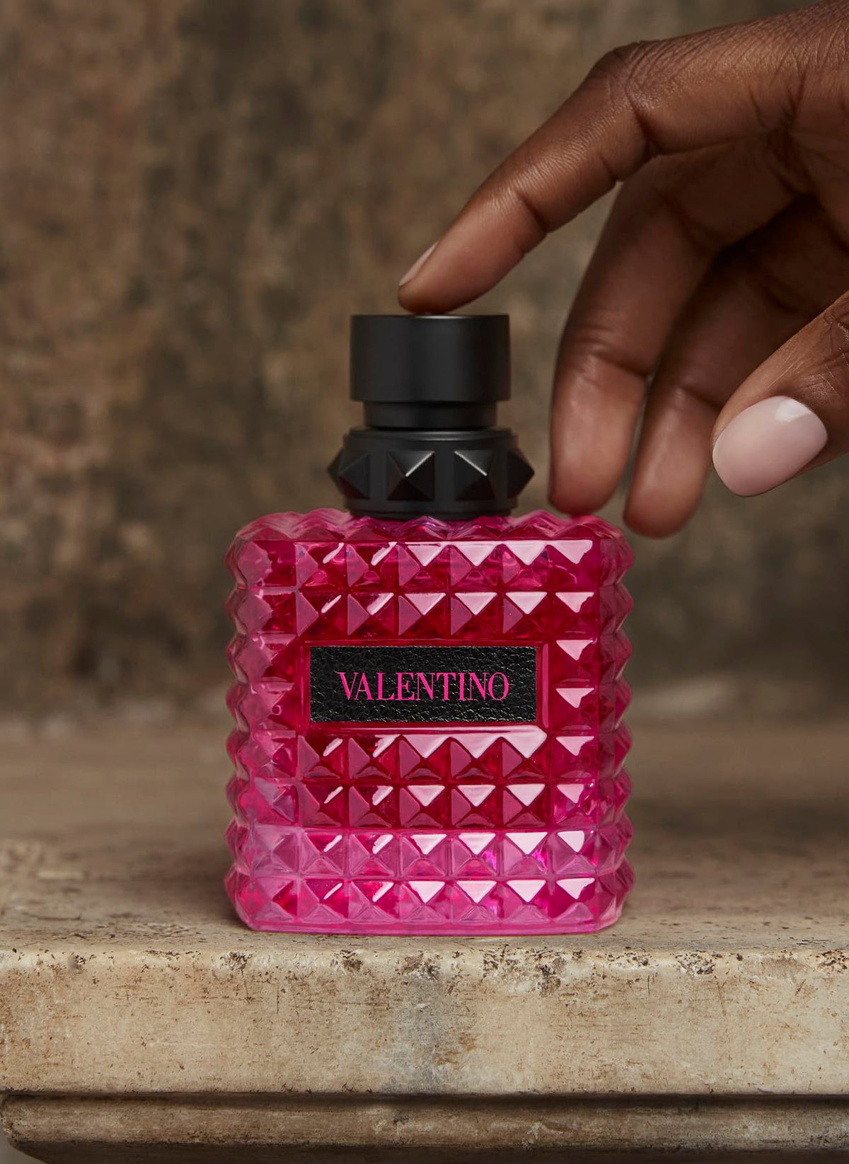 Valentino bottle styled on dressing table conveying evening-ready indulgence