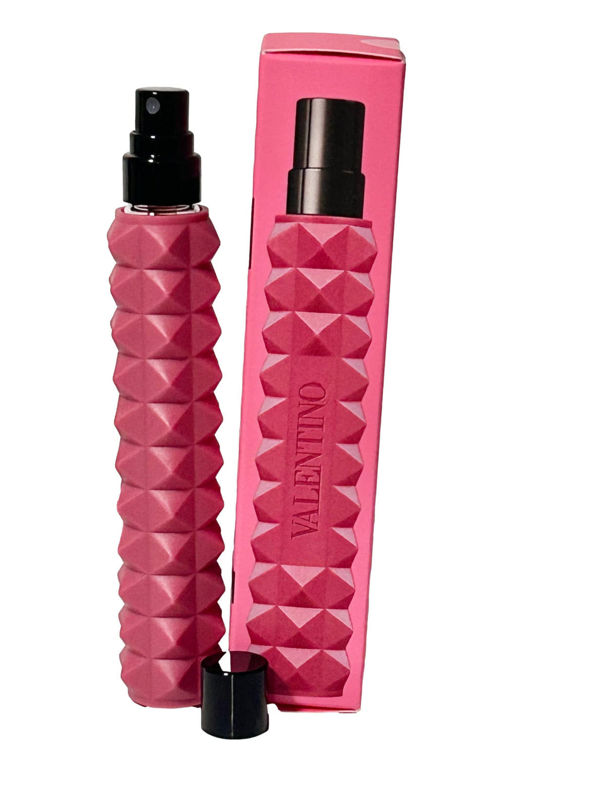Valentino travel spray in hand illustrating compact 0.34 oz size and easy portability