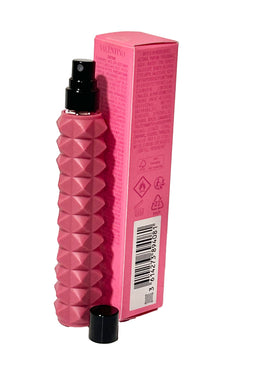 Valentino perfume placed inside a purse depicting convenience and confidence on the go