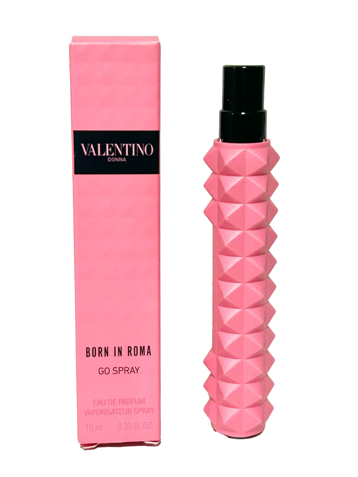 Valentino Donna Born In Roma mini EDP beside an evening clutch showing suitability for nights out and quick refreshes