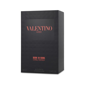 Valentino lifestyle usage on dressing table showing bottle with outfit for effortless styling