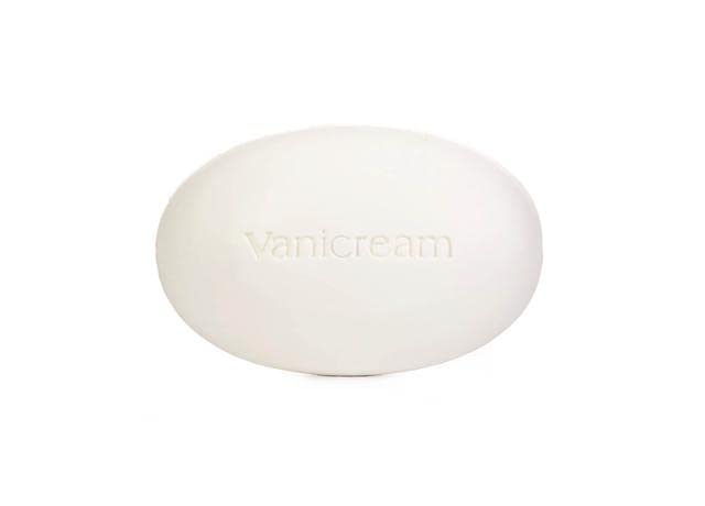 Vanicream bar in hand for scale showing compact travel-friendly size