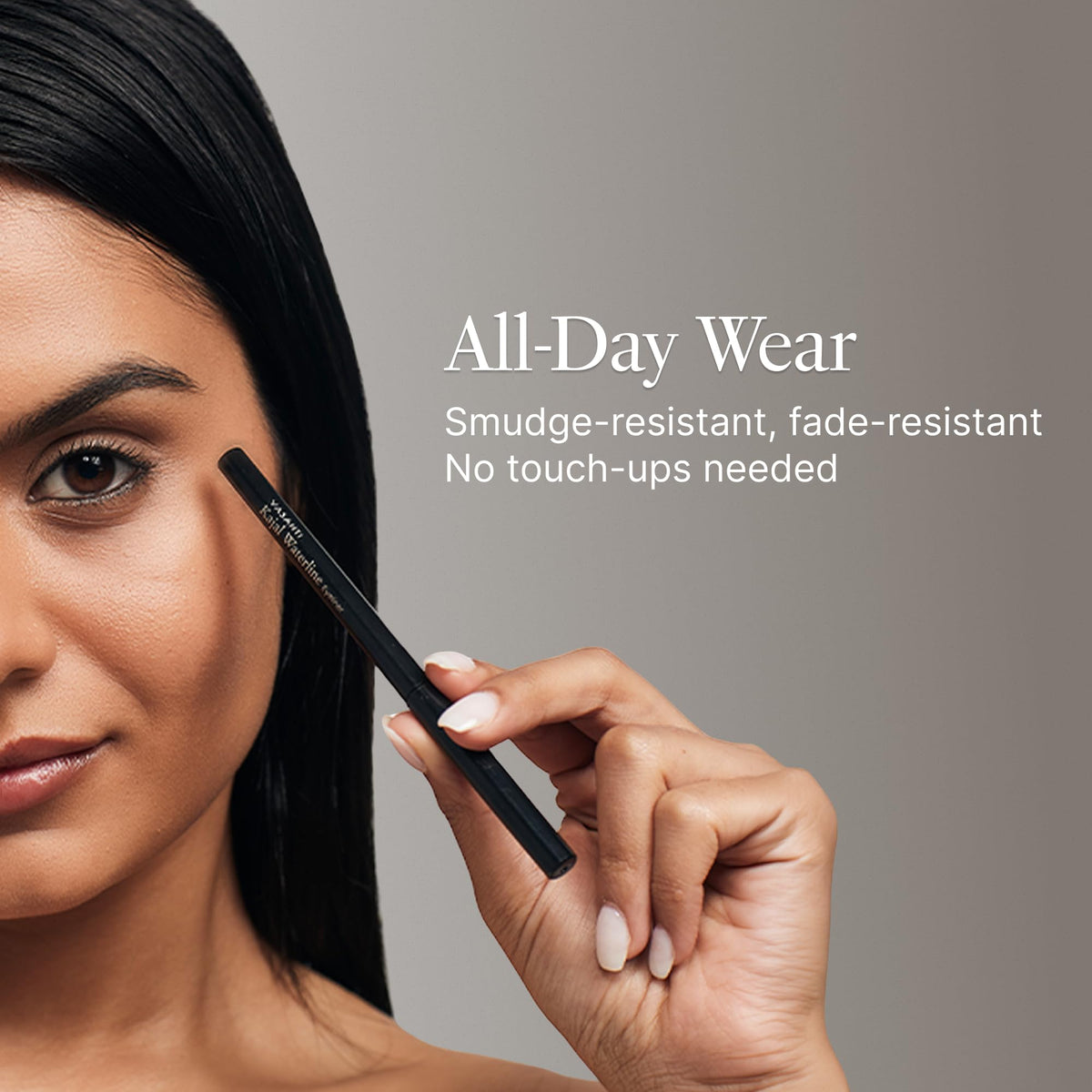 VASANTI eyeliner beside coin to show compact travel-friendly size