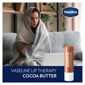 Vaseline balm being applied to lips for immediate soothing and protection