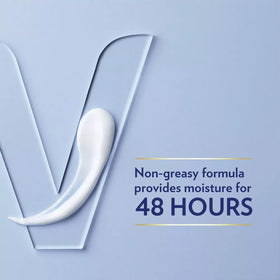 Vaseline lotion being dispensed from open cap demonstrating easy travel use
