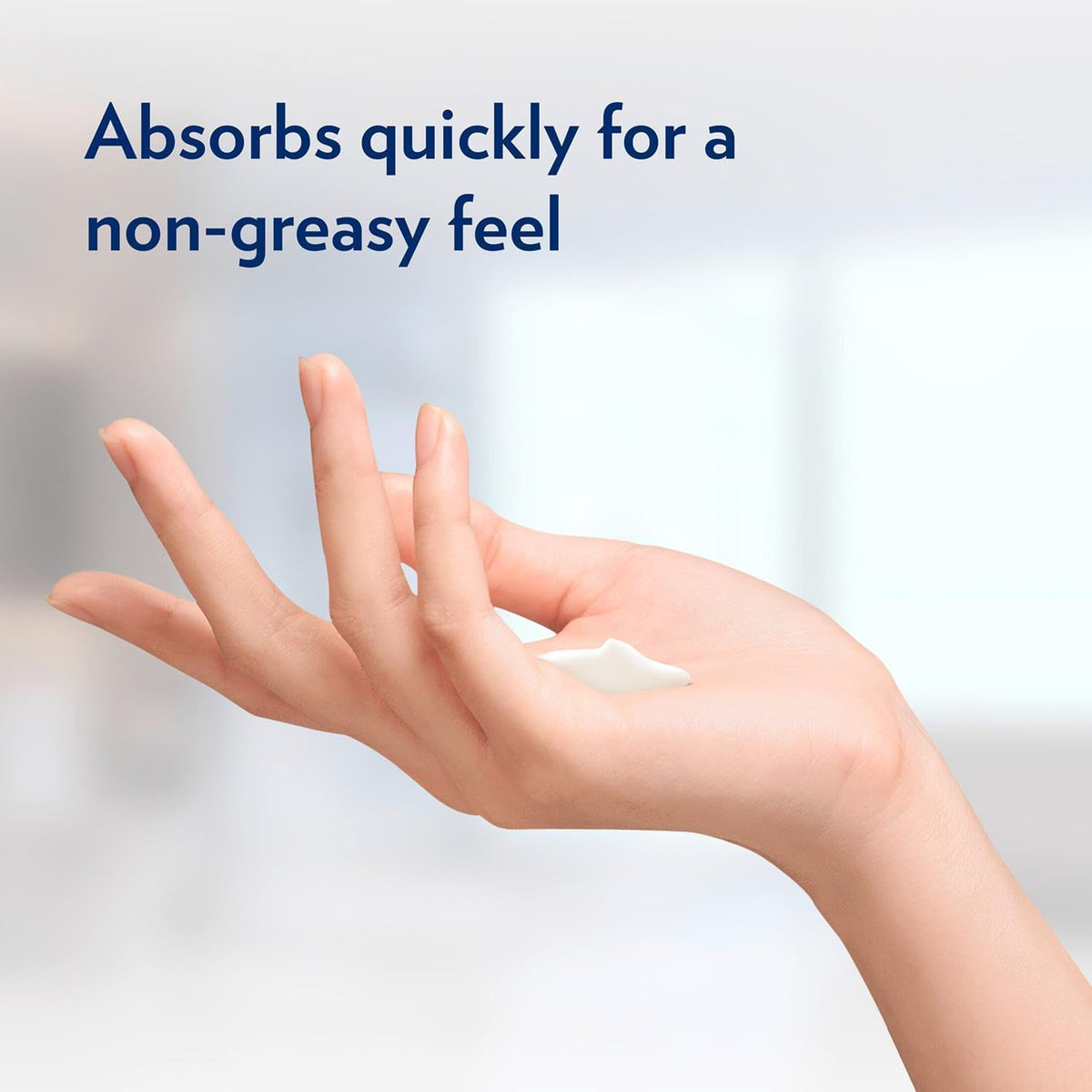 Applying Vaseline lotion on hands to show fast absorption and smooth finish