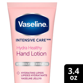 Vaseline 3.4 oz tube next to ruler illustrating compact travel-friendly size