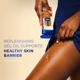 Vaseline label close-up highlighting cocoa butter and replenishing oils benefit