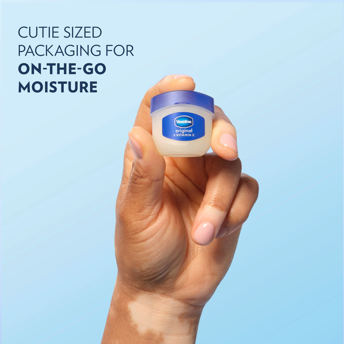 Applying Vaseline Lip Therapy on lips for instant moisture and protection