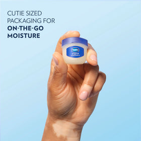 Applying Vaseline Lip Therapy on lips for instant moisture and protection