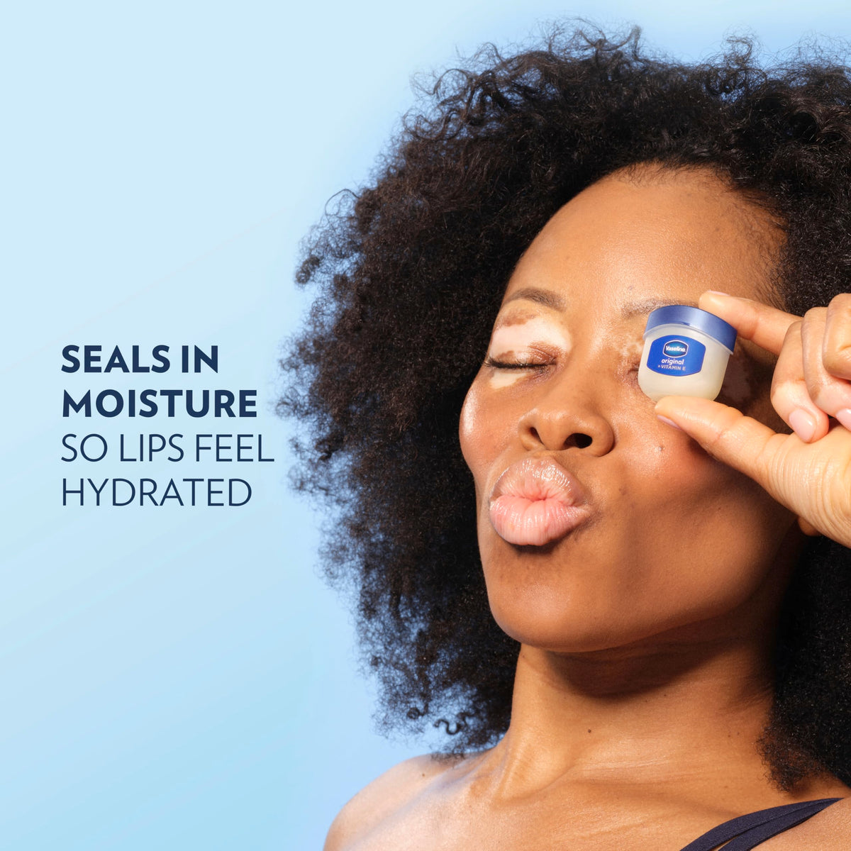Vaseline tin in hand to show pocketable size and convenient scale