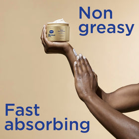 Applying Vaseline cream to arm, demonstrating quick absorption and softness