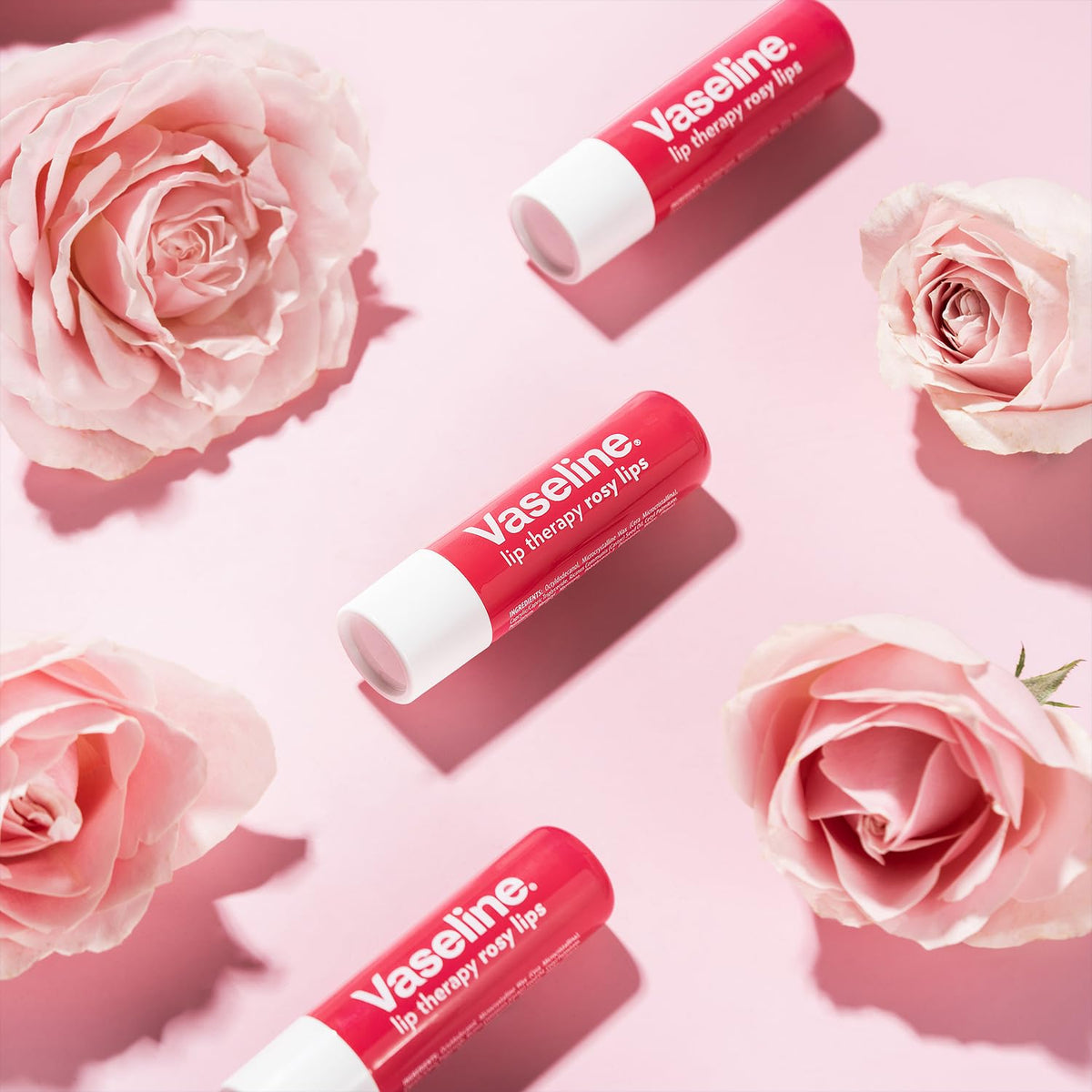 Eight Vaseline rosy lips sticks arranged to display bulk supply and value benefit