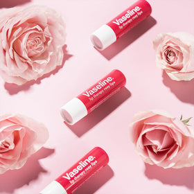 Eight Vaseline rosy lips sticks arranged to display bulk supply and value benefit