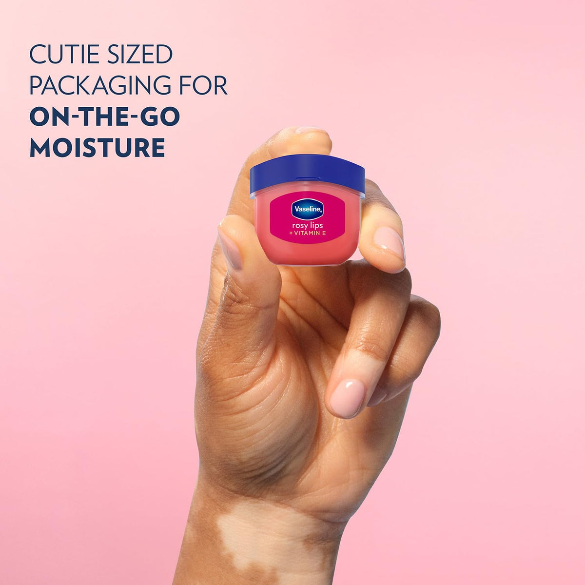 Vaseline rosy lips held in hand showing scale and easy pocket portability benefit