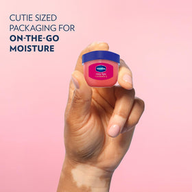 Vaseline rosy lips held in hand showing scale and easy pocket portability benefit