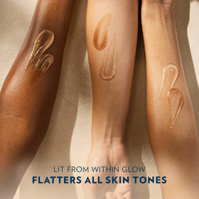 Close-up swatch of Vaseline shimmer on forearm revealing subtle reflective finish